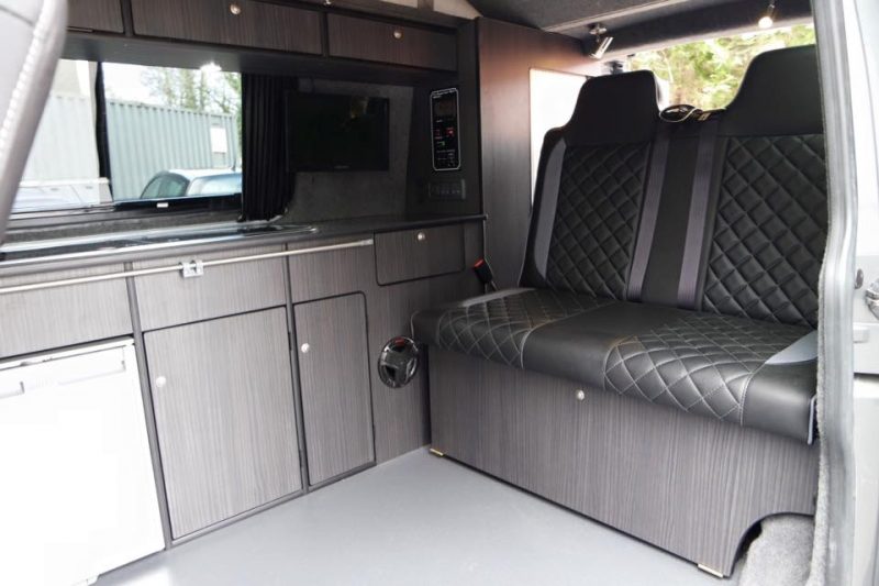 Moore's Custom Campers Full Conversion on VW T5 SWB in Hacienda Black and Smoke Flooring with Diamond Stitched Rock and Roll Bed